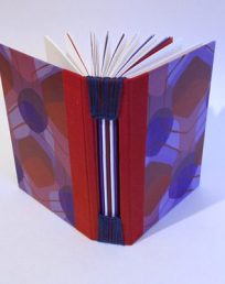 Notebook with buttonhole binding