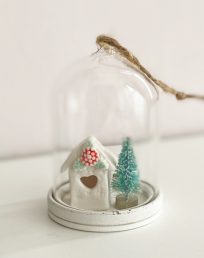 Little holly house in a glass dome